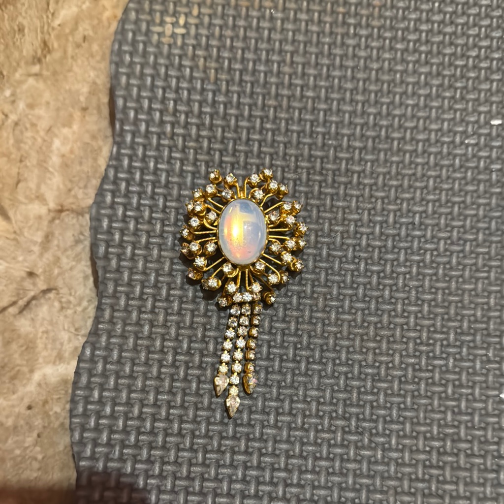 Gold And White Brooch With Intricate Detailing 10$